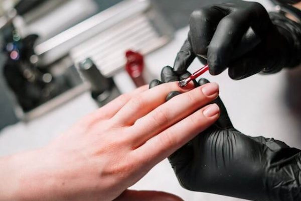 Person getting their nails done safely