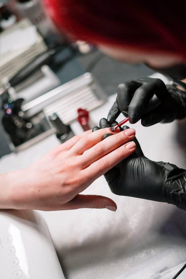 Person getting their nails done safely